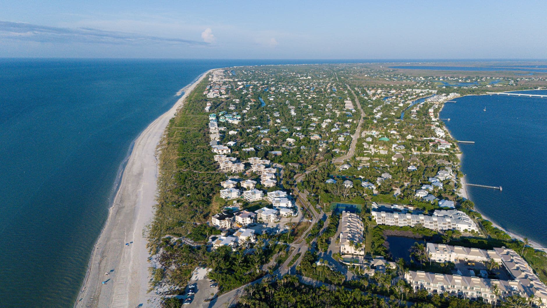Stunning aerial photo of Sanibel Island, FL, showcasing the coastline and residential areas.